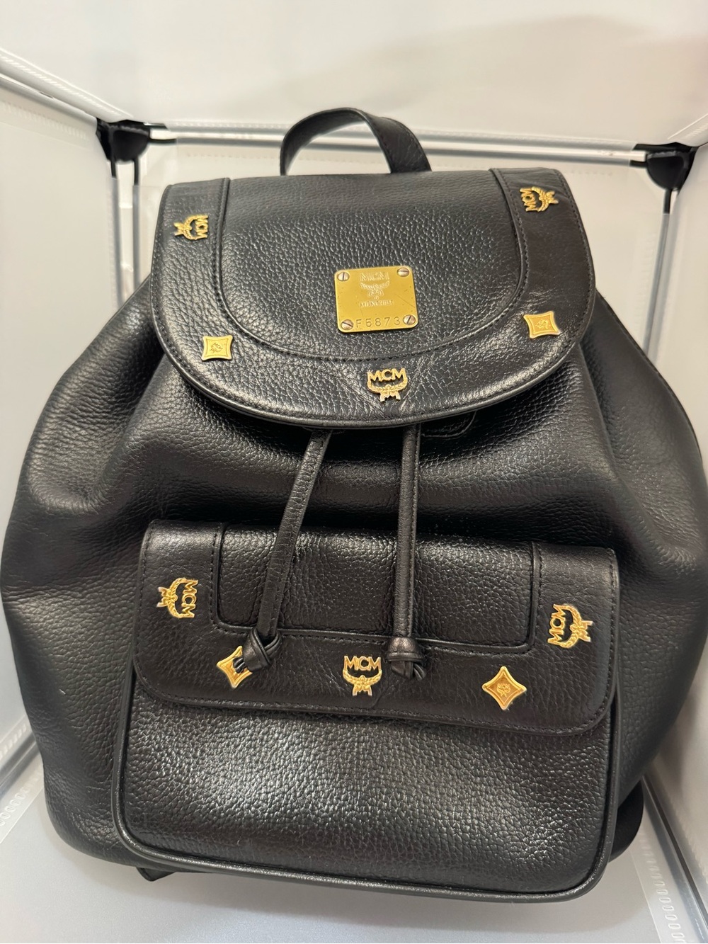MCM Black Leather Backpack with Gold Logo Accents